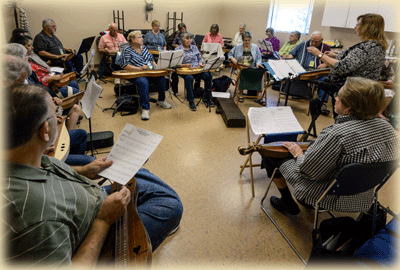 Irma teaching mountain dulcimer